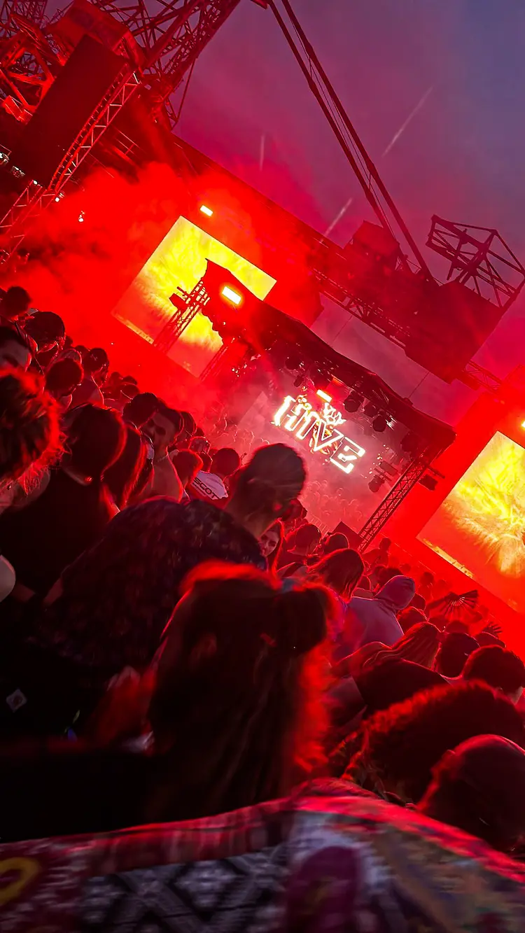 Festival photo with many people and red lights