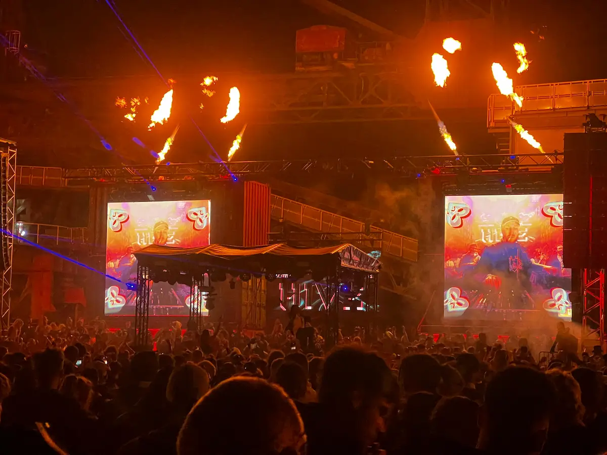 Festival photo at night with fire and stage